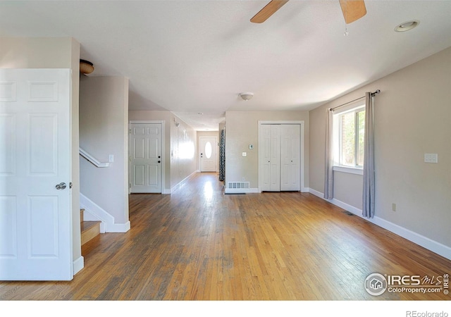 empty room featuring hardwood / wood-style floors and ceiling fan