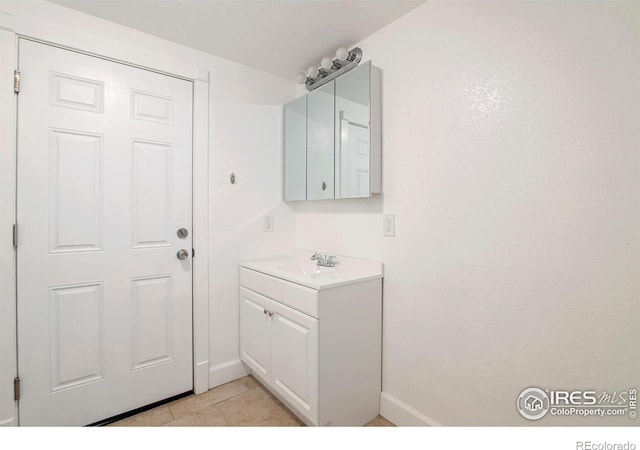 bathroom with vanity and tile patterned floors