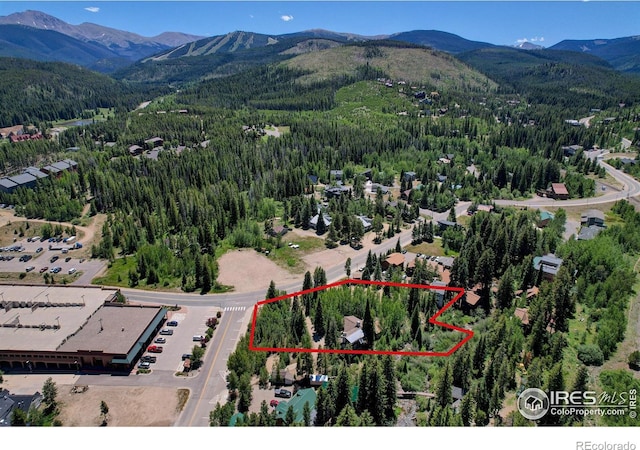 birds eye view of property with a mountain view