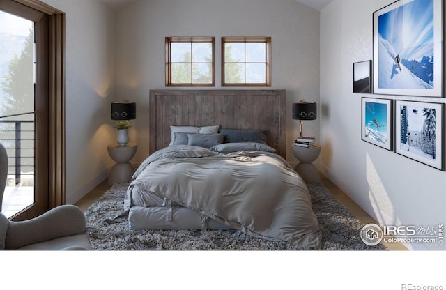 bedroom with lofted ceiling