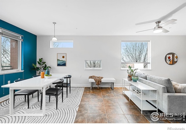 dining space with ceiling fan