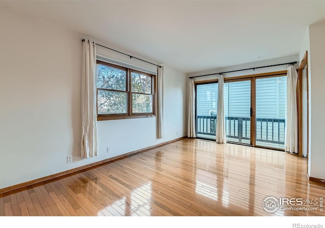 unfurnished room featuring light hardwood / wood-style floors