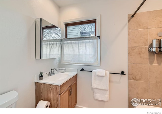 bathroom with vanity and toilet