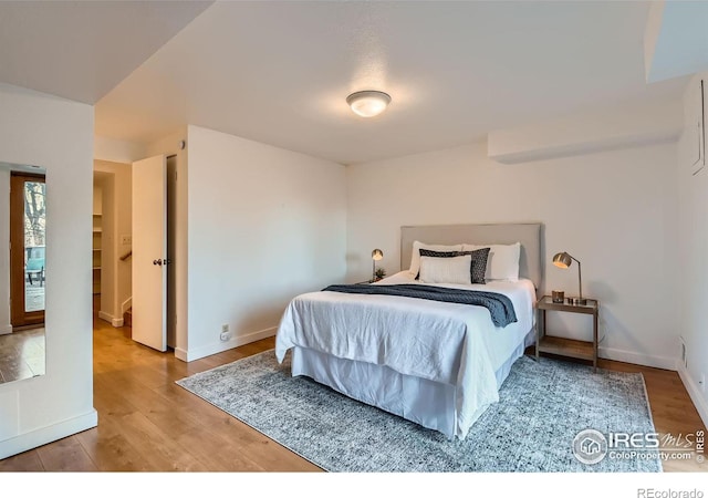 bedroom featuring wood-type flooring