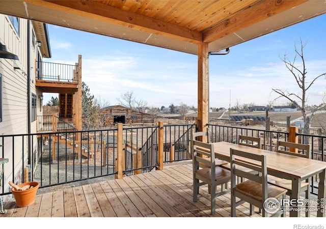 wooden deck featuring outdoor dining space