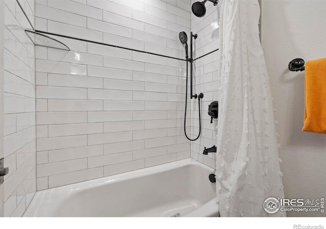 bathroom with shower / tub combo with curtain