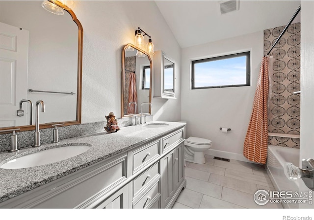 bathroom featuring toilet, a sink, and visible vents