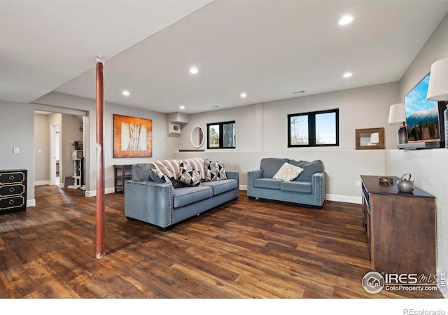 living room with baseboards, wood finished floors, and recessed lighting