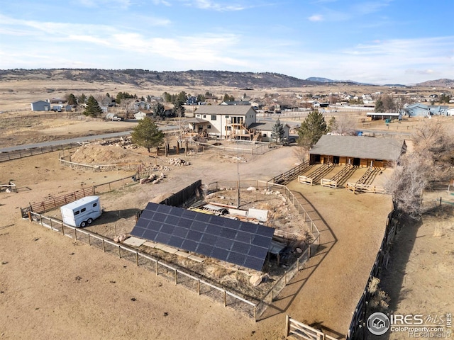 drone / aerial view featuring a mountain view