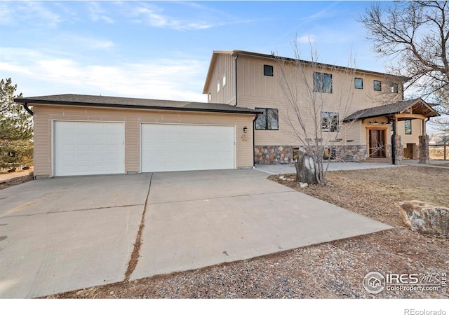 view of front of house featuring a garage and concrete driveway