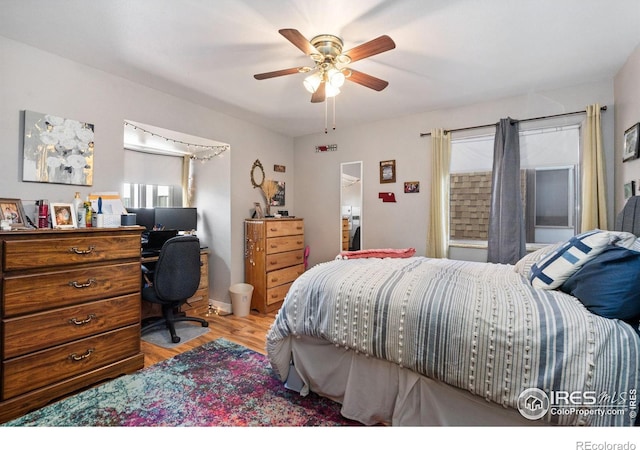 bedroom with ceiling fan and light hardwood / wood-style flooring