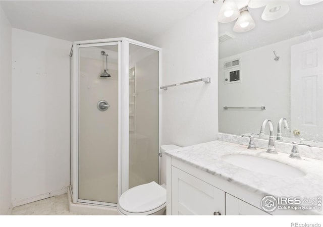 bathroom with vanity, toilet, and walk in shower