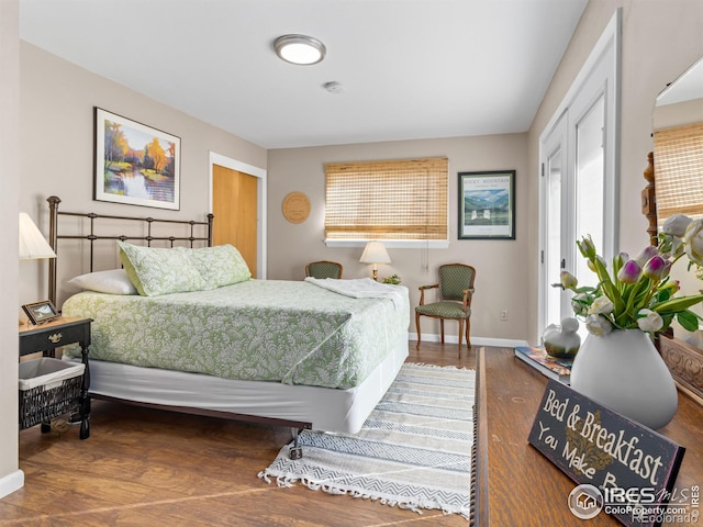 bedroom with hardwood / wood-style floors