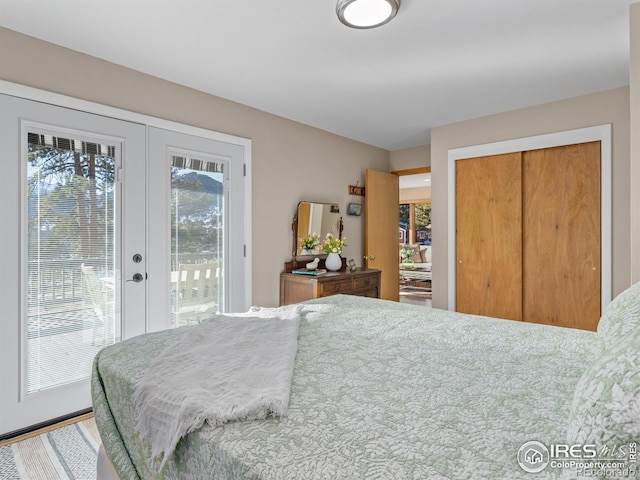 bedroom featuring access to exterior, a closet, and french doors