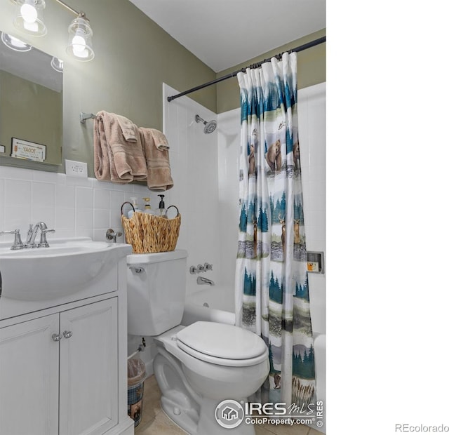 full bathroom with tasteful backsplash, toilet, shower / tub combo with curtain, vanity, and tile walls