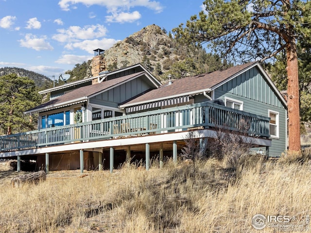 back of house featuring a deck