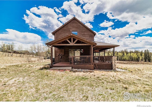 view of front of home featuring a porch and a rural view