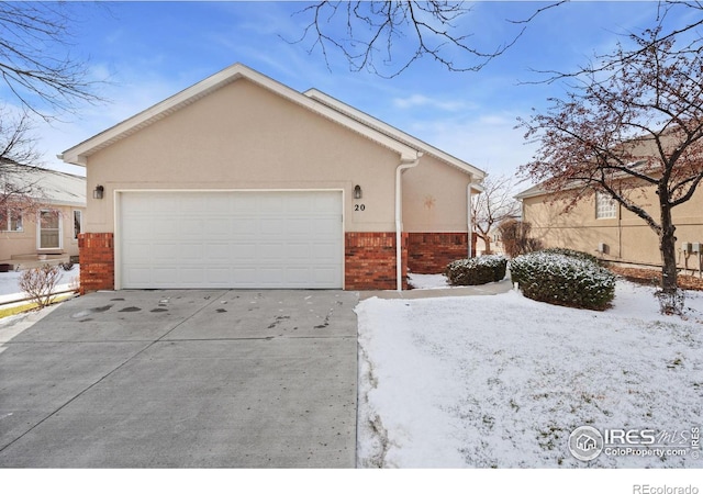 view of snowy exterior with a garage