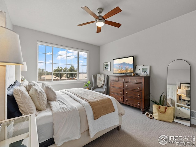 carpeted bedroom with ceiling fan