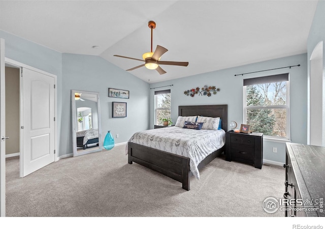 bedroom featuring ceiling fan, lofted ceiling, and light carpet