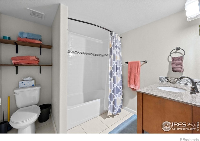 full bathroom with shower / bath combination with curtain, backsplash, vanity, tile patterned flooring, and toilet