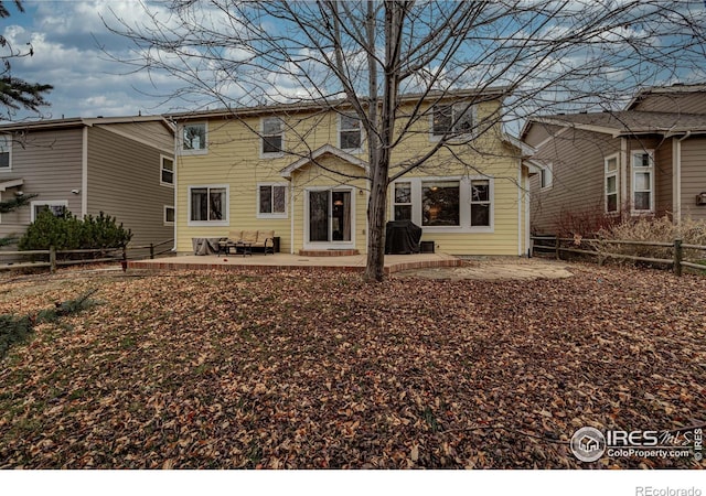 back of property featuring a patio