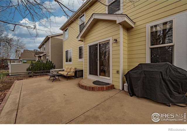 view of patio featuring outdoor lounge area and a grill