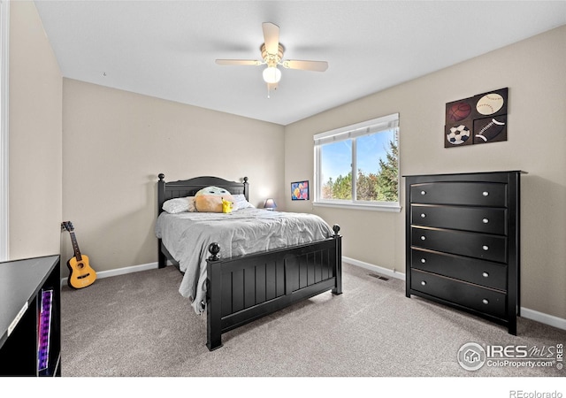 carpeted bedroom with ceiling fan