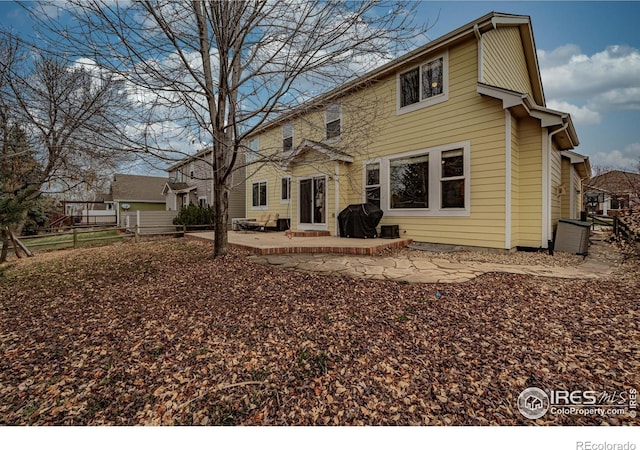 rear view of house with a patio