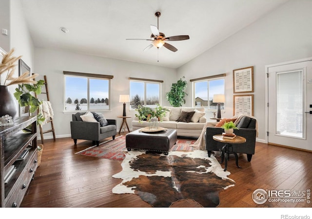 living room featuring vaulted ceiling, ceiling fan, and dark wood-type flooring