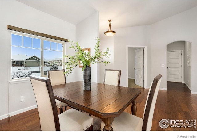 dining area with dark wood-type flooring