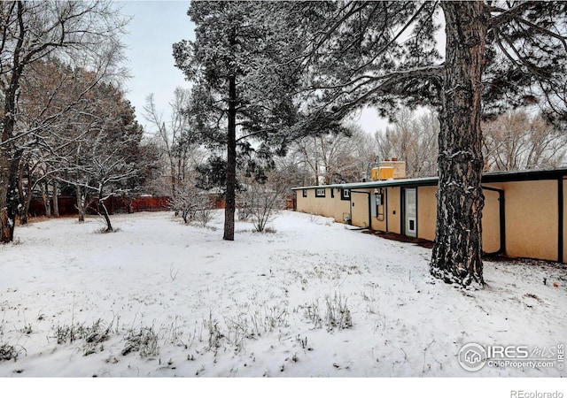 view of yard covered in snow