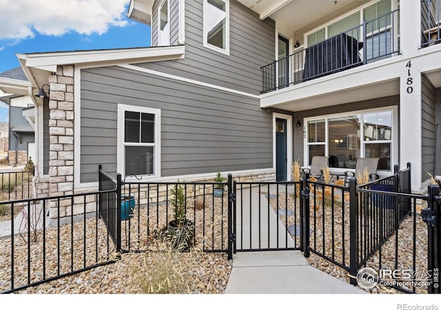 entrance to property with a balcony