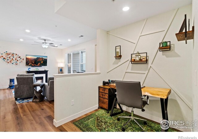 office area featuring hardwood / wood-style floors and ceiling fan