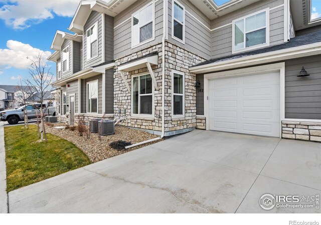 view of side of property with a garage