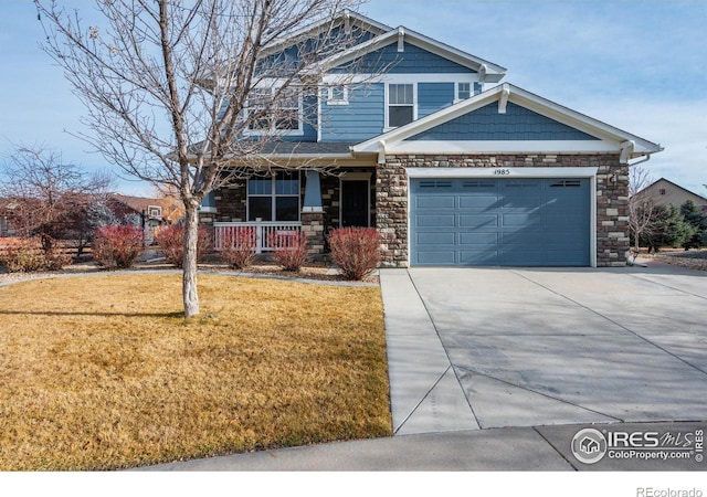 craftsman-style house with covered porch and a front yard