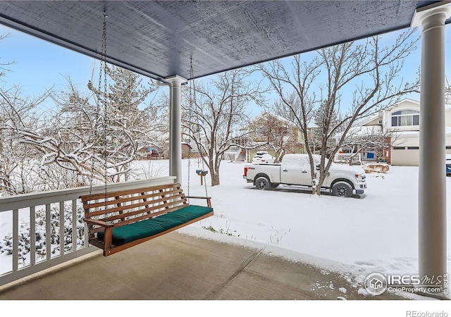 view of snow covered patio