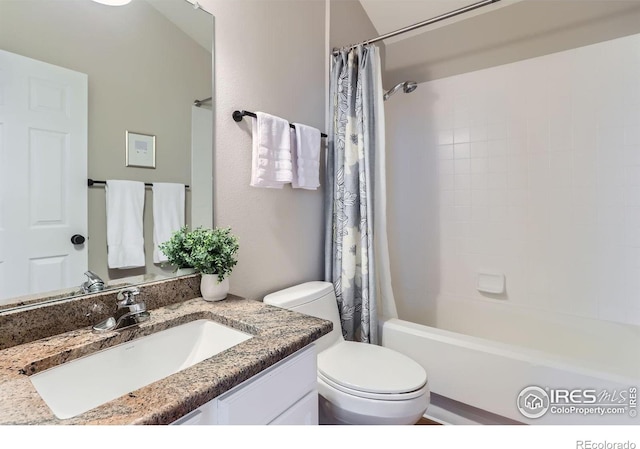 full bathroom featuring shower / tub combo, vanity, and toilet