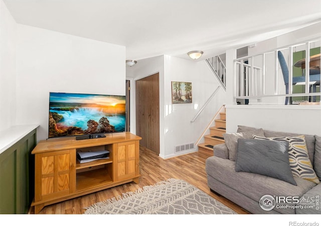 living room with light hardwood / wood-style floors