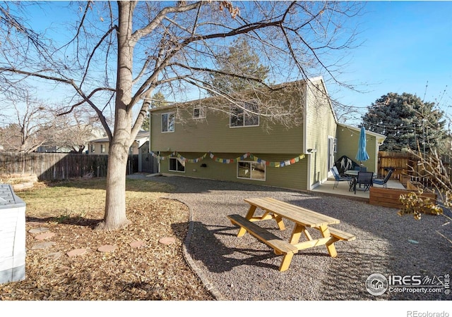 rear view of house featuring a patio area