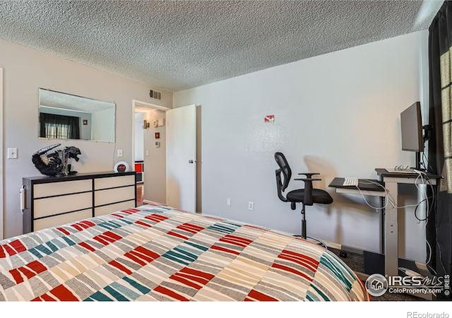 bedroom with a textured ceiling