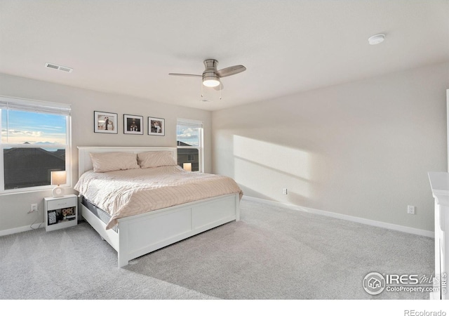 carpeted bedroom with ceiling fan