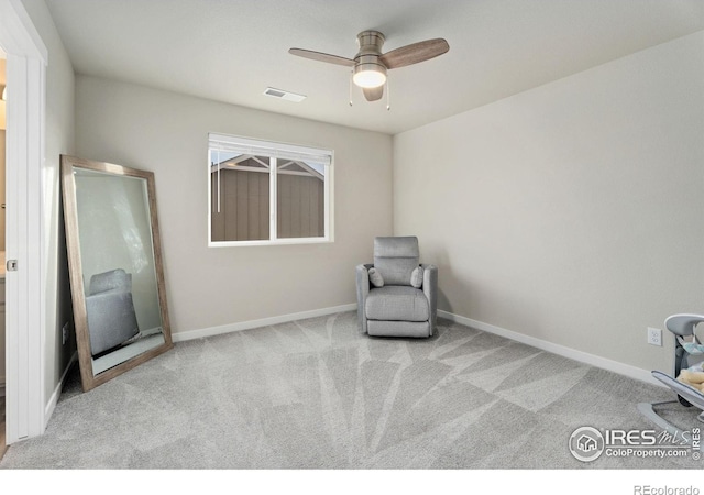 unfurnished room featuring light colored carpet and ceiling fan