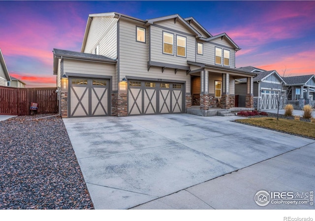 view of front of house with a porch and a garage