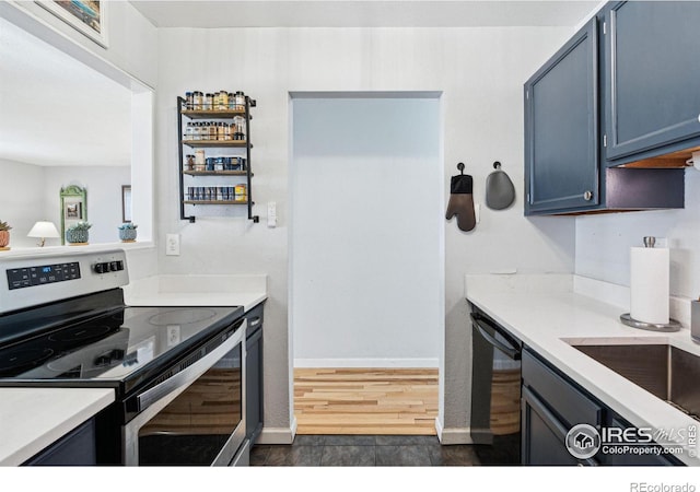 kitchen with sink and appliances with stainless steel finishes