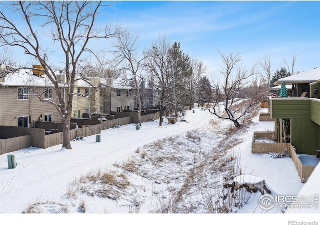 view of yard layered in snow