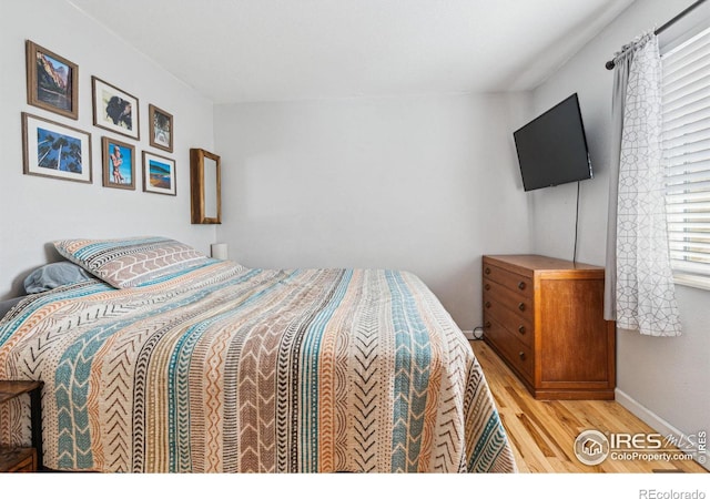 bedroom with light hardwood / wood-style flooring