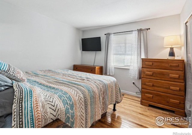 bedroom with wood-type flooring