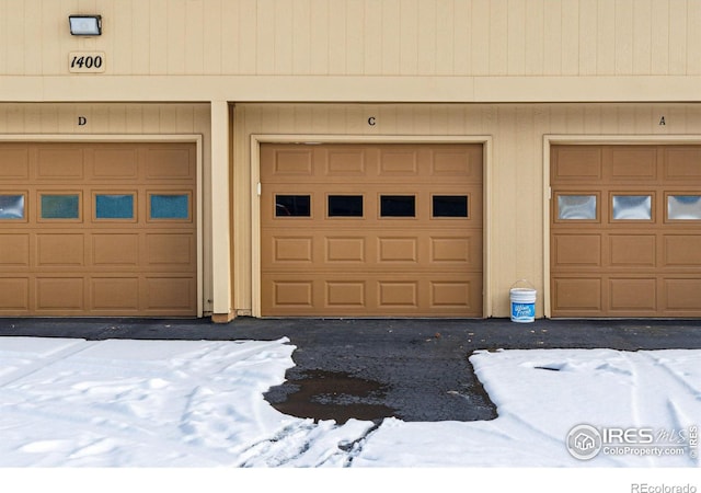 view of snow covered garage