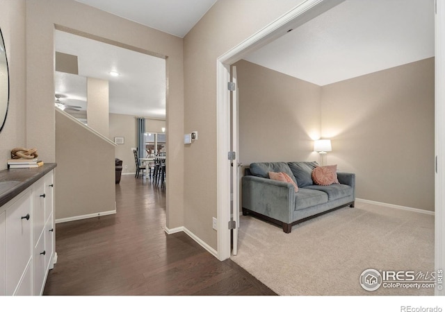 hallway with dark hardwood / wood-style flooring